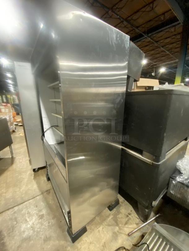 True TAC-48-LD open grab-n-go merchandiser display case in stainless steel, with adjustable racks and on legs.