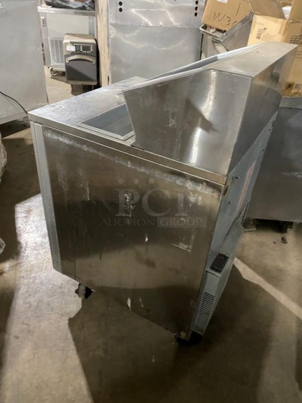 Silver King stainless steel single door ice cream topping fountainette, Model SKFSM/C7, on casters, used condition.
