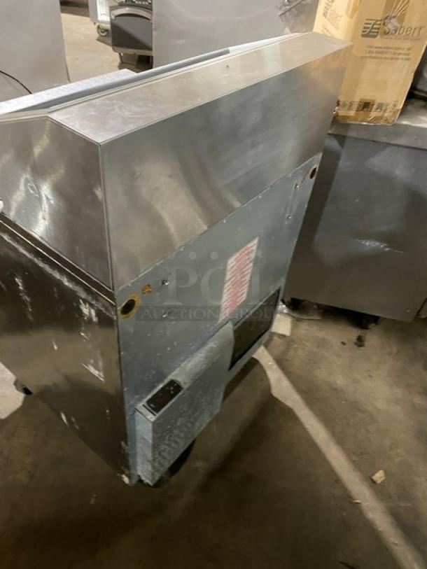 Silver King SKFSM/C7 stainless steel refrigerated ice cream topping workstation, poly-coated rack, on casters, used condition.