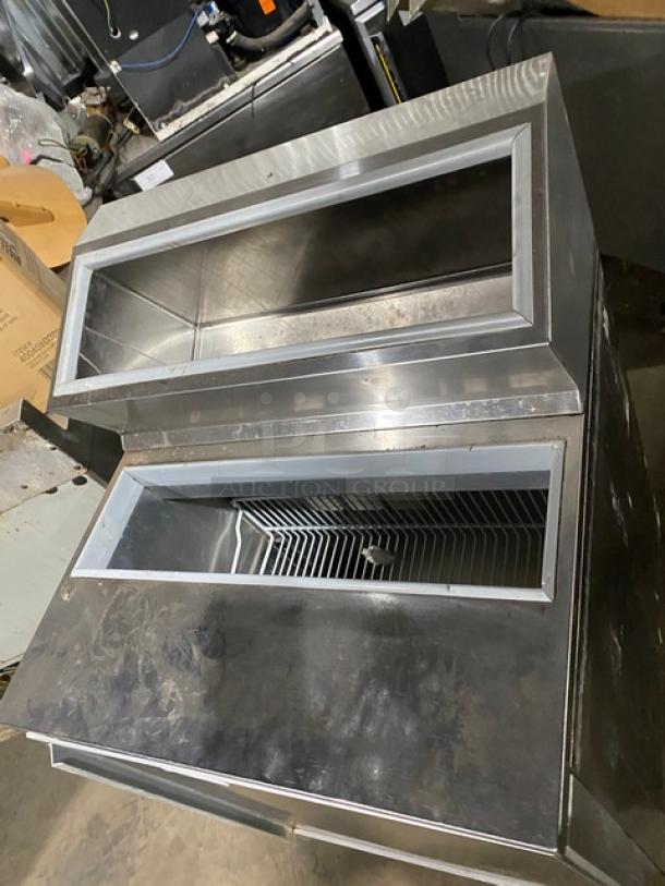 Silver King SKFSM/C7 stainless steel ice cream topping fountainette, single door, on casters, with poly-coated rack.