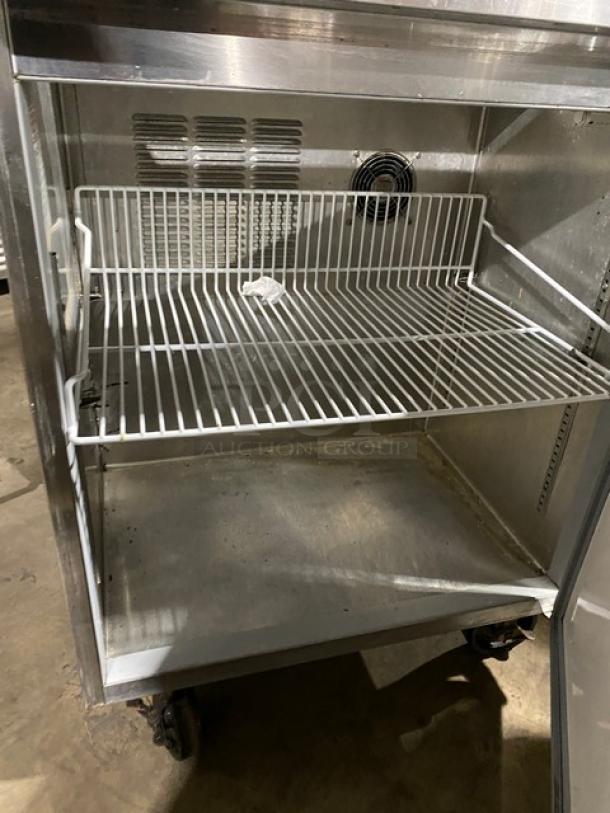 Silver King stainless steel refrigerated ice cream topping workstation, model SKFSM/C7, poly coated wire rack, on casters.