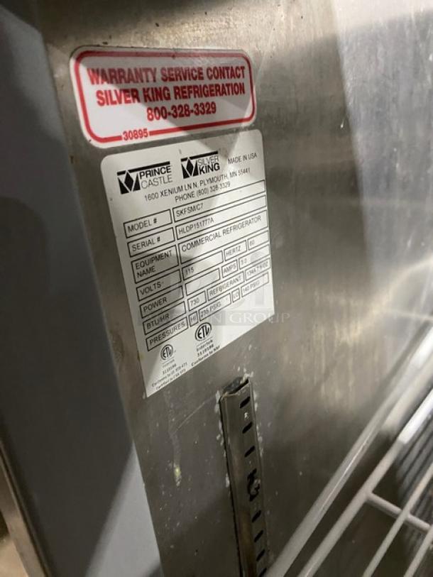 Silver King stainless steel refrigerated condiment workstation, Model SKFSM/C7, SN: HLDP151777A, 115V, on casters, with poly coated rack.