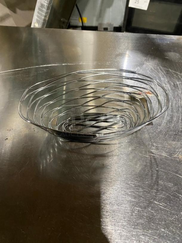 American Metalcraft chrome-plated 9"x6" oval birdnest basket, model FRUC16. New condition, spiral design.