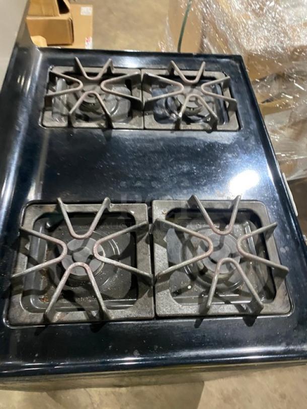 Amana commercial 4-burner natural gas range/oven combo, stainless steel/black, with digital push button controls, wired oven rack.