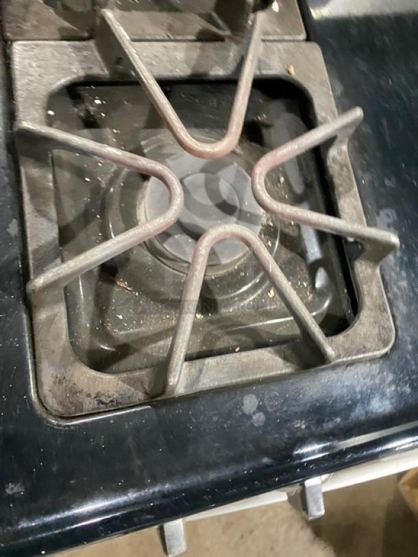 Amana commercial 4-burner range/oven, stainless steel/black, natural gas, digital controls, wired oven rack, used condition.