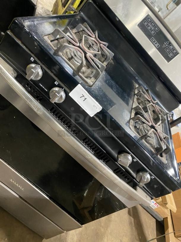 Amana commercial stainless steel/black 4-burner gas range/oven combo with digital controls and wired oven rack, good condition.