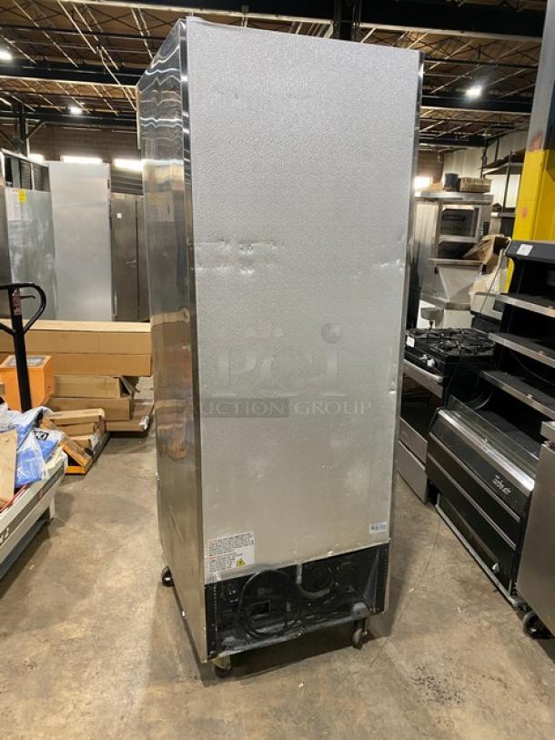 Universal stainless steel single solid door reach-in freezer with poly-coated wired rack, on casters, in used condition.