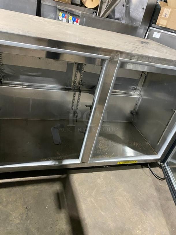 Silver King SKF48G commercial stainless steel double glass swing door reach-in undercounter freezer. Model SKF48G, SN: SAJF69736B. 115V.