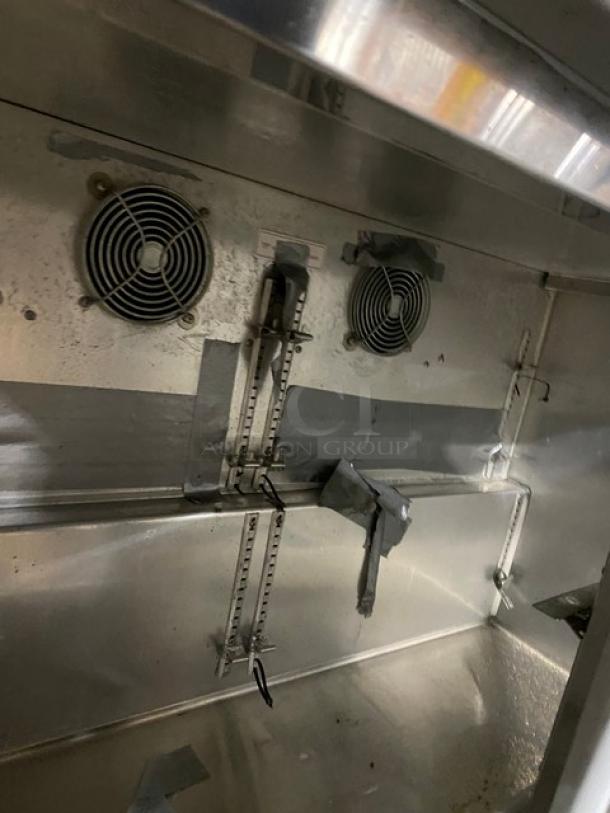 Silver King SKF48G commercial stainless steel undercounter freezer interior, showing double glass swing doors and cooling fans.