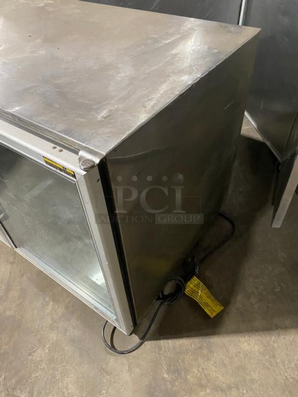 Silver King stainless steel double glass door undercounter freezer, model SKF48G. Features 115V power, good condition.
