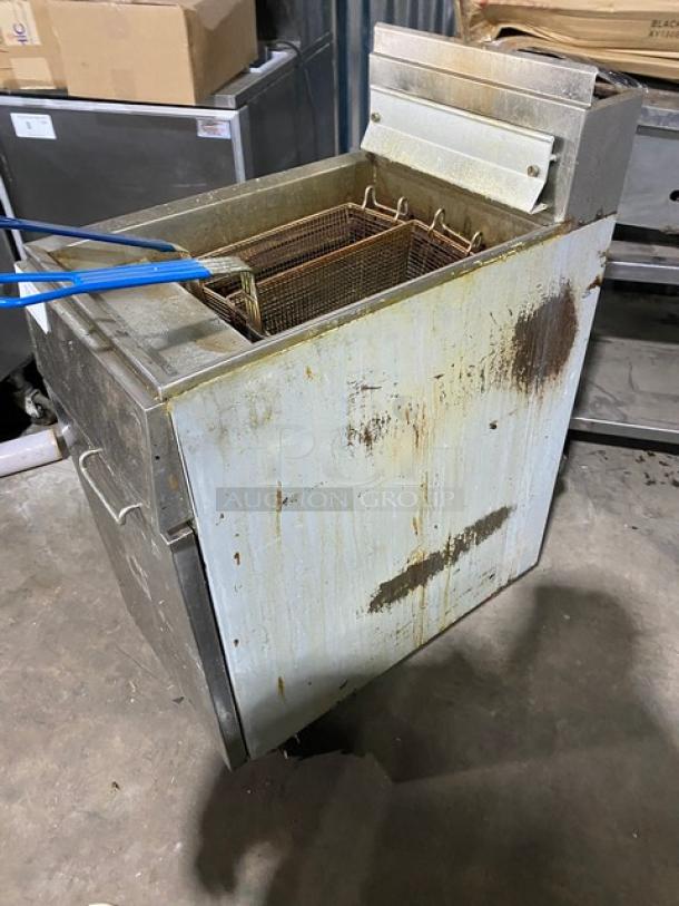 Frymaster GF14SD commercial stainless steel gas fryer with backsplash, basket hanger, and fry basket. Visible wear on exterior.