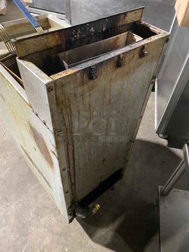 Frymaster GF14SD commercial stainless steel natural gas fryer with backsplash and basket hanger. Visible wear and marks.