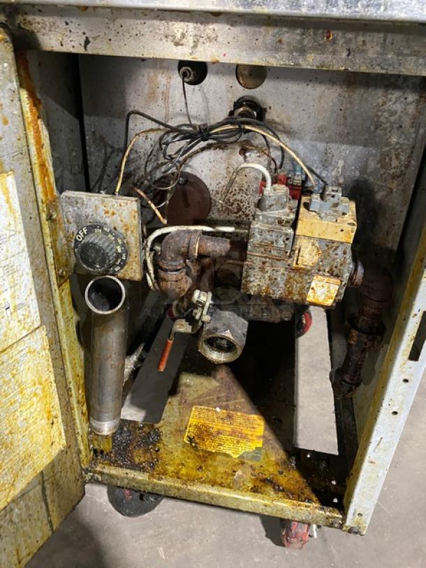 Frymaster GF14SD commercial fryer with backsplash, basket hanger, visible wear, and natural gas setup. Model: GF14SD, SN: 0003FM0962.