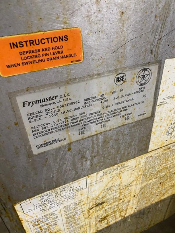 Frymaster GF14SD commercial gas fryer with backsplash, basket hanger, and fry basket. Serial: 0003FM0962. Instructions label visible.