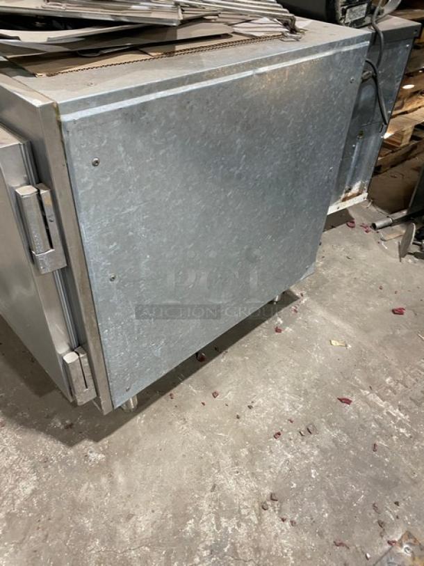 Traulsen UC2HT commercial stainless steel 2-door undercounter refrigerator, 69", with pan slide and chrome rack, on legs.