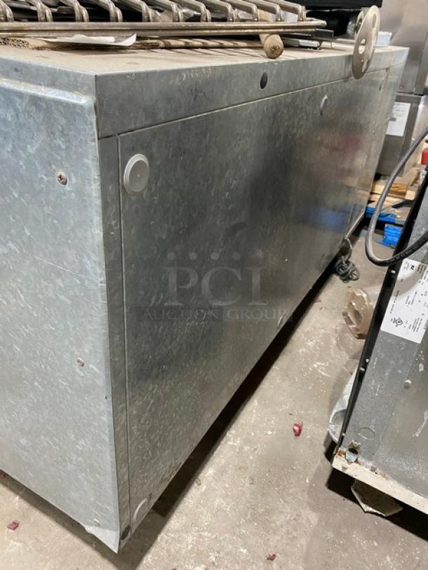 Traulsen commercial stainless steel 2-door undercounter refrigerator, model UC2HT, with built-in pan slide, chrome rack.