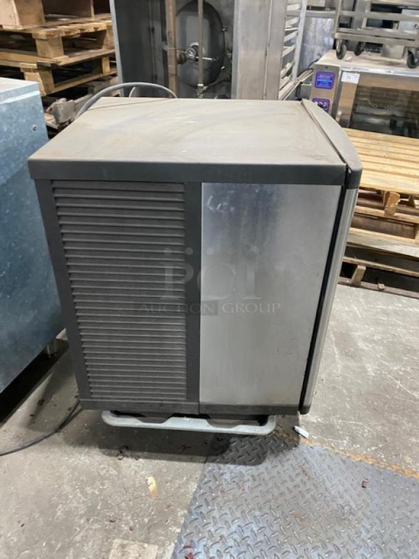 Manitowoc QY0425W ice making machine, stainless steel, water-cooled, electric-powered, 115V, used condition, visible wear.