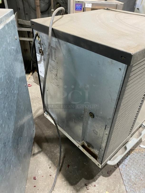 Manitowoc QY0425W stainless steel water-cooled ice machine head, electric powered, 115V, showing exterior condition and power cords.