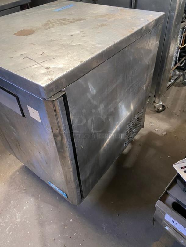 Delfield 406CA-DHL-DD1 commercial undercounter stainless steel refrigerator with coated rack, on casters, moderate wear.