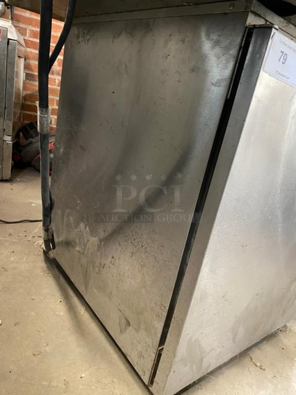 Delfield stainless steel undercounter refrigerator, model 406CADHLDD1, with solid single door, coated wire rack, on casters, 115V.