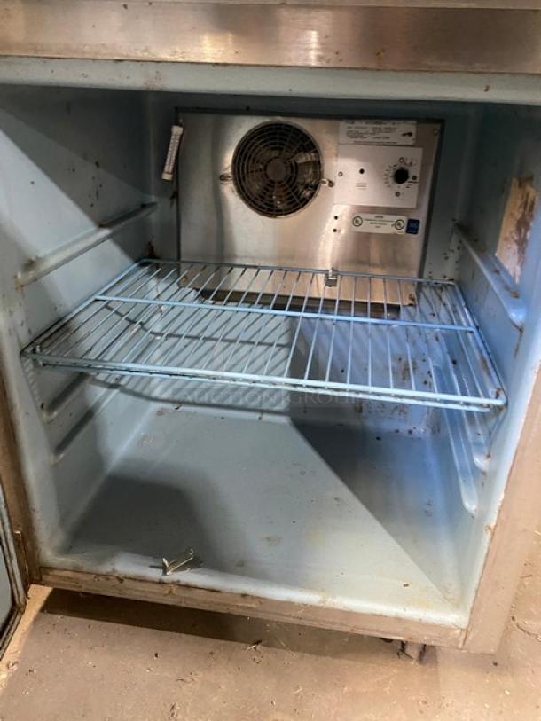 Delfield 406CA-DHL-DD1 commercial stainless steel undercounter refrigerator, single door, wired rack, on casters, 115V, used.