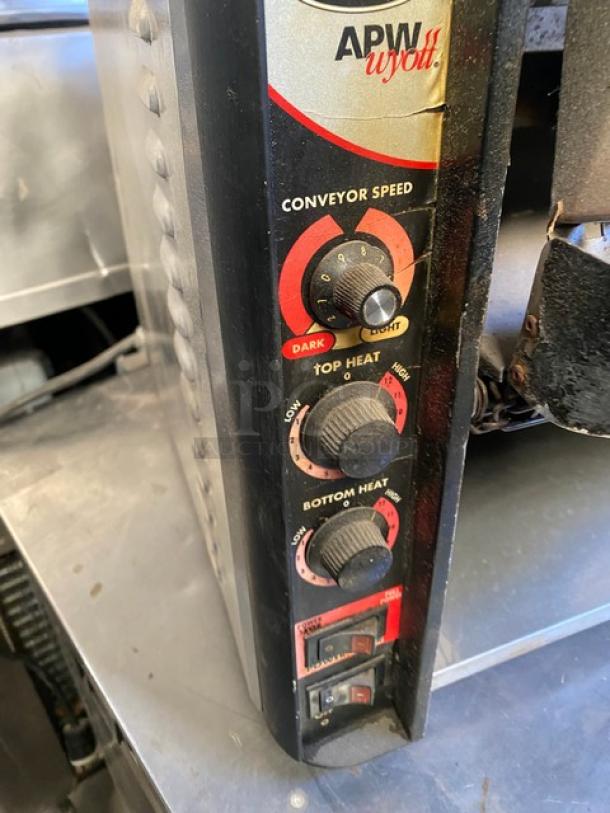 APW Wyott X*Treme Series commercial conveyor toaster, model XTRM-3H. Features adjustable conveyor speed, top and bottom heat controls, stainless steel exterior.