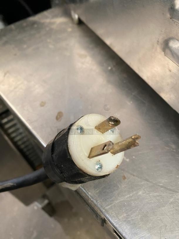 APW Wyott XTRM3H stainless steel electric conveyor toaster with 13" wide belt, 3" opening, visible power plug, 208V, 1-phase.