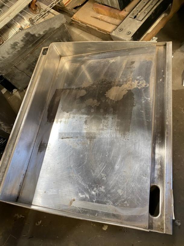 Keating stainless steel gas-powered countertop flat griddle with back and side splash, thermostatic control, and on legs. Used condition.