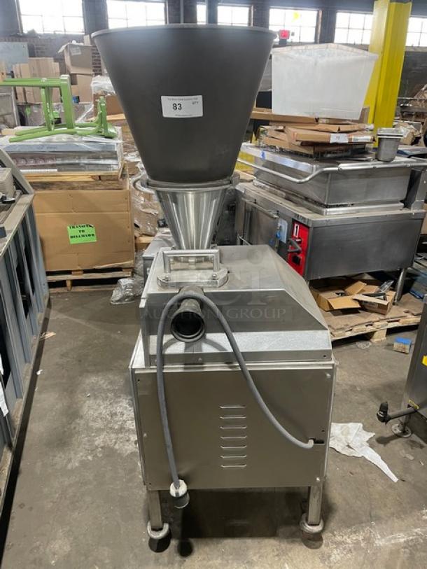 Commercial stainless steel electric vacuum stuffer/filler on casters, excellent condition, visible power cord, item label "83".