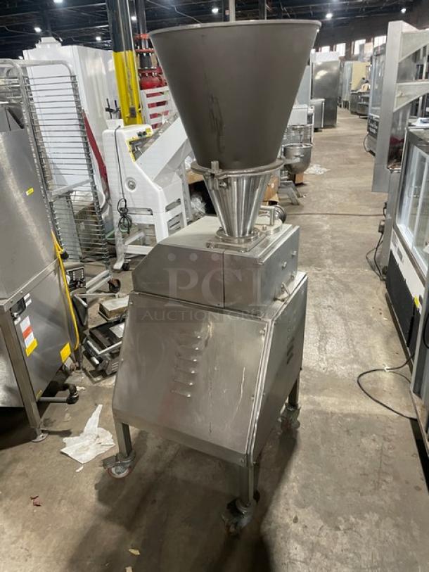 Commercial stainless steel electric vacuum stuffer/filler, free-standing, on casters, well-maintained condition.