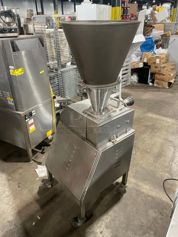 Commercial stainless steel electric vacuum stuffer/filler on casters, clean condition, ideal for food industry use.