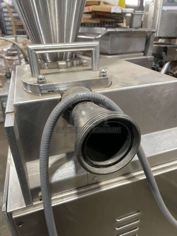 Commercial stainless steel electric vacuum stuffer/filler on casters, excellent condition, durable, industrial-grade design.