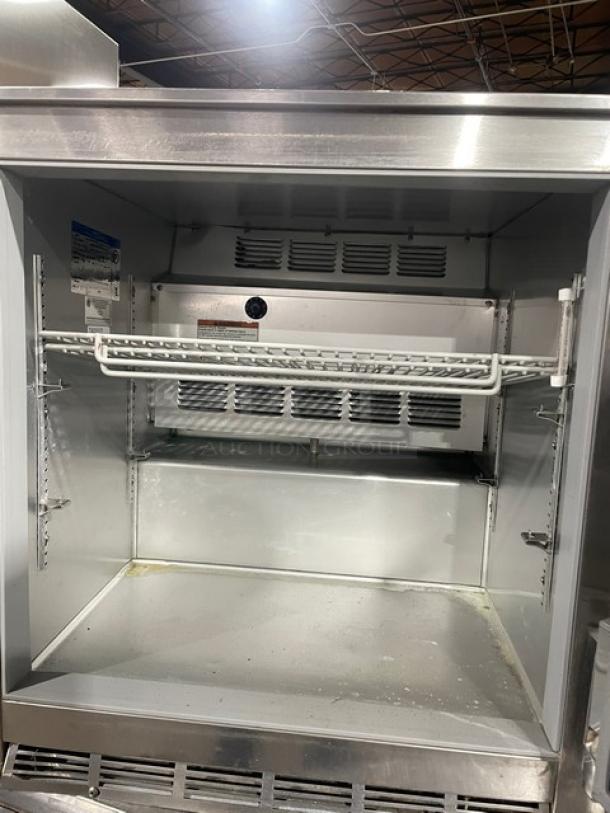 Beverage-Air UCR27Y stainless steel undercounter refrigerator with poly-coated wired rack, shallow-depth, single door, 115V.