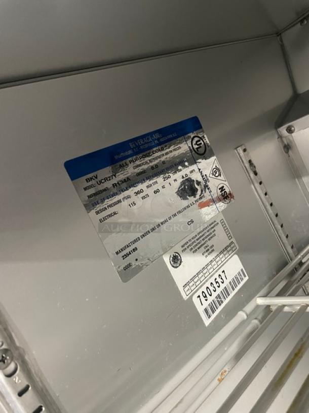 Beverage-Air UCR27Y commercial undercounter refrigerator, stainless steel, shallow depth, with poly coated wired rack, model and specs visible.