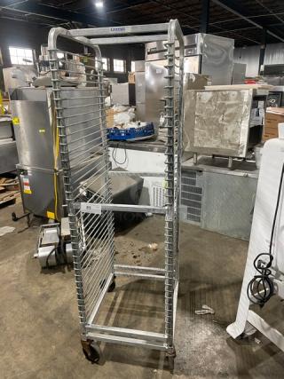 Channel aluminum 36-pan end load mobile rack with wire slides, on casters. In good condition, ideal for commercial use.