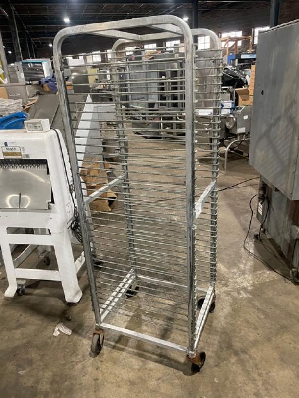 Channel Commercial Aluminum 36-Pan End Load Mobile Rack with wire slides and casters, used condition. Ideal for bakeries and kitchens.