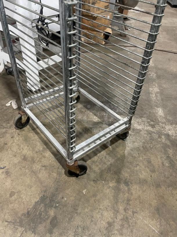 Channel aluminum 36-pan mobile rack with wire slides on casters. Sturdy condition, ideal for commercial kitchen use.