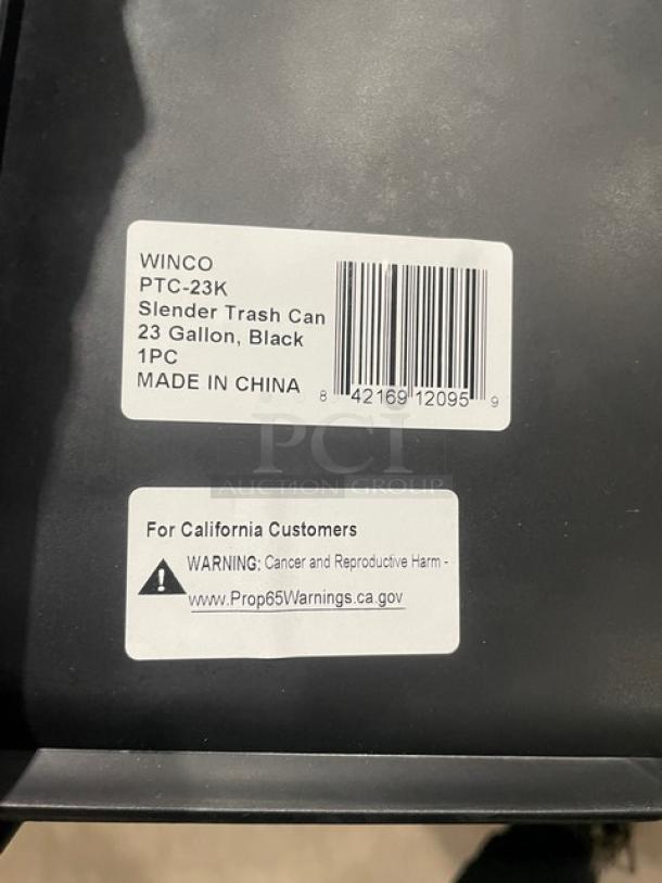 Winco 23 Gal. Black Slender Trash Can, Model PTC23K. New condition, tags indicate make, model, and Prop 65 warning.
