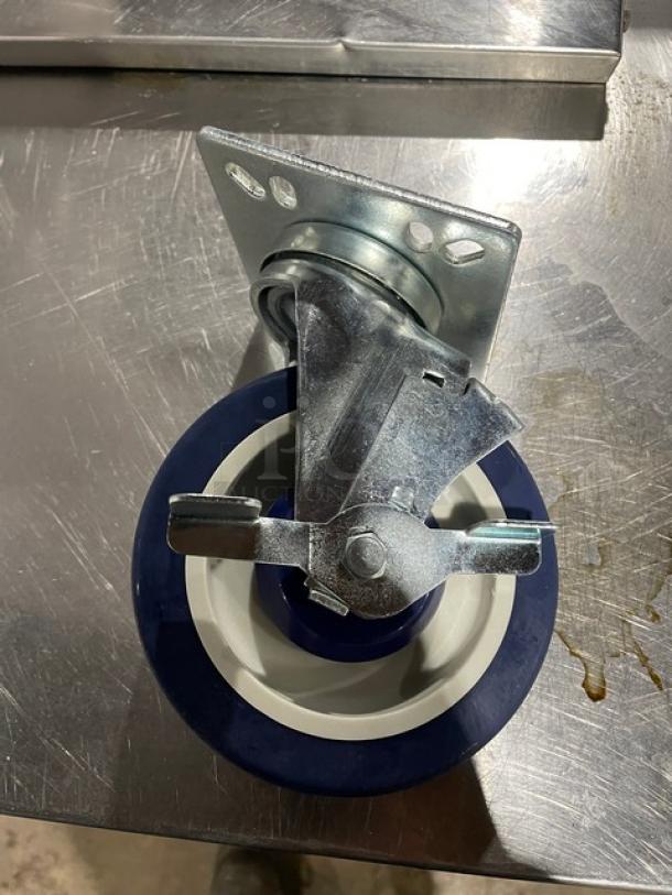 Focus Foodservice 5" polyurethane caster with brake, stainless steel 4" square mounting plate, model FPCST5HD, new condition.