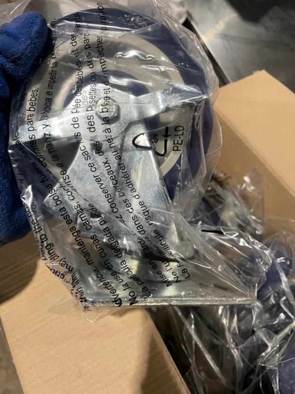 Focus Foodservice caster set, model FPCST5HD, with black polyurethane 5" wheels, stainless steel 4" square mounting plate, in packaging.