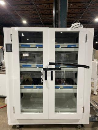 Urban Cultivator Commercial 001 indoor garden with white double glass doors, electric-powered, on casters.