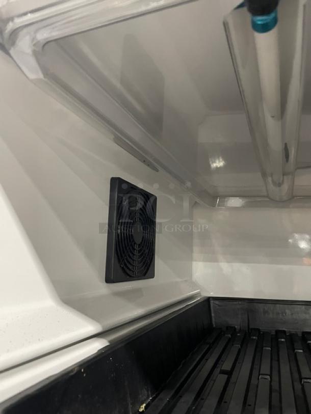 Urban Cultivator Commercial indoor garden with a white double glass door, fan detail, electric-powered for herbs and microgreens.