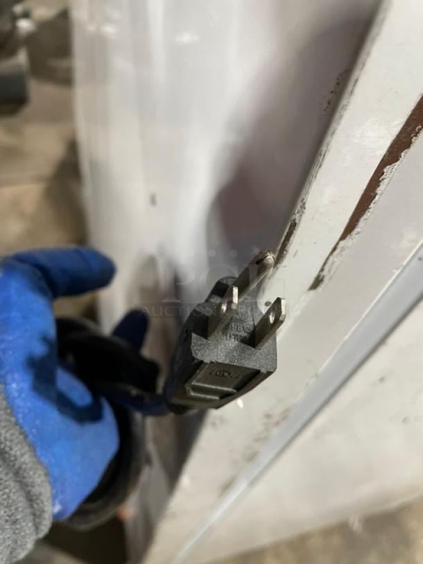 Urban Cultivator Commercial electric indoor garden plug, showing close-up of power cord connector. Model: Commercial001.