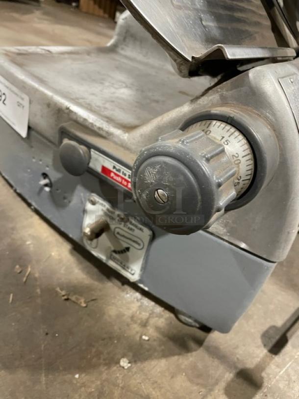 Hobart model 2712 deli slicer, gray, electric-powered, semi-automatic, countertop design, 120V, condition shows signs of use.