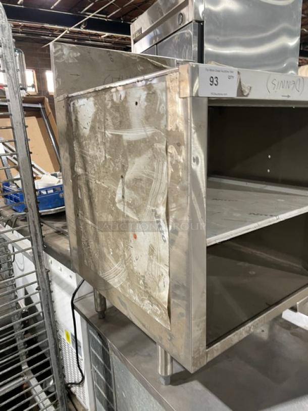 Krowne Royal 2100 Series 2-tier stainless steel glass storage unit with drainboard, backsplash, and legs. Scratch-n-dent condition. Model KR21-GSB3. Serial number 10030006017.