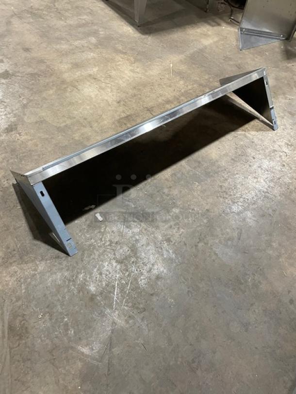 Commercial stainless steel wall-mount shelf, rectangular, excellent condition, sturdy construction, with mounting brackets.
