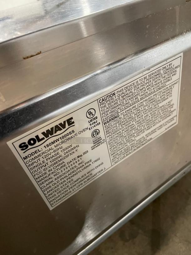 Solwave 2023 stainless steel commercial microwave, model 180MW1000SS, with digital control, 120V 1 Phase, on legs, label shown.