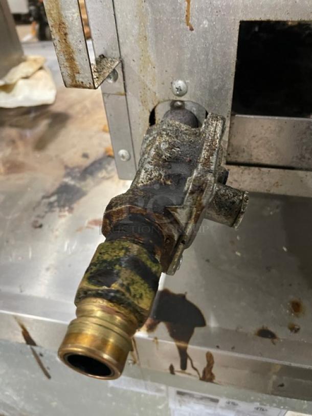 Southbend HDO-12 stainless steel 2-burner hotplate, natural gas, visible wear, serial number 24H11060, on legs.