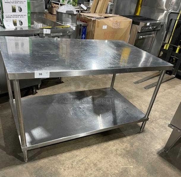 Commercial stainless steel worktop table with single undershelf and legs. Durable, polished finish. Tag number 98 visible.
