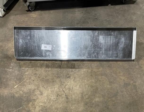 Commercial stainless steel rectangular wall-mount shelf, reflective finish, pre-owned. Label reads '95'.